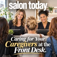 Two receptionists waiting on guests in a salon