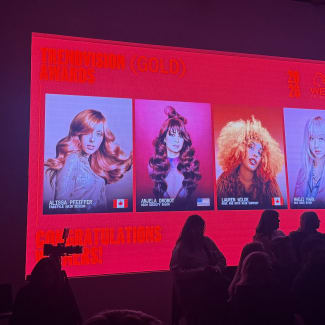 A photo of a screen that shows four model images