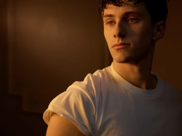 A male model with short hair in a white tshirt