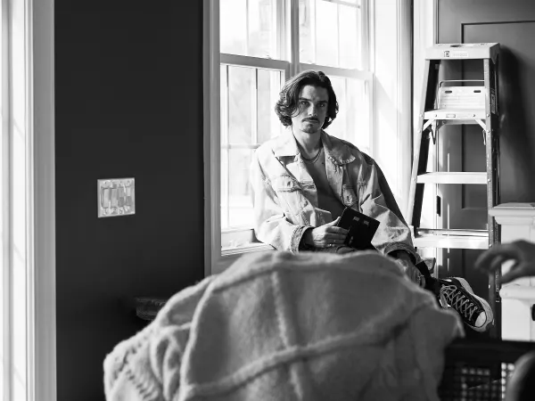 A male model rests off set