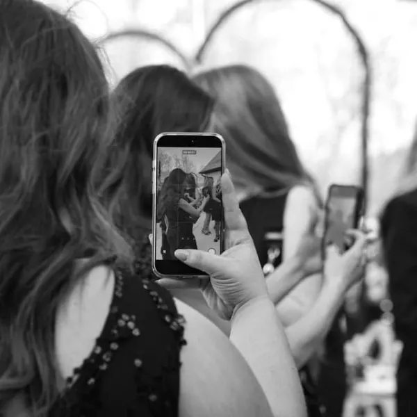 A stylist photographs an image for social media