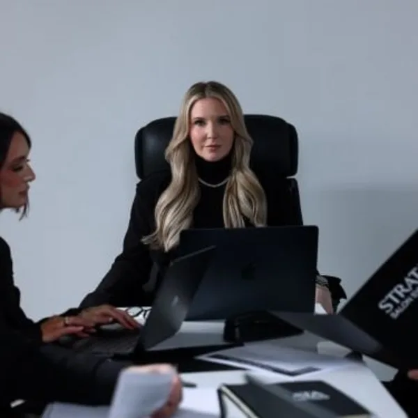 Woman sitting in boardroom 