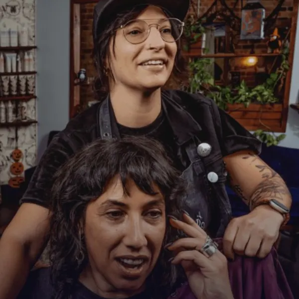 Hair Has No Gender is the nonprofit founded by Chicago stylist and salon owner, Jamie DiGrazia, shown here with a client.