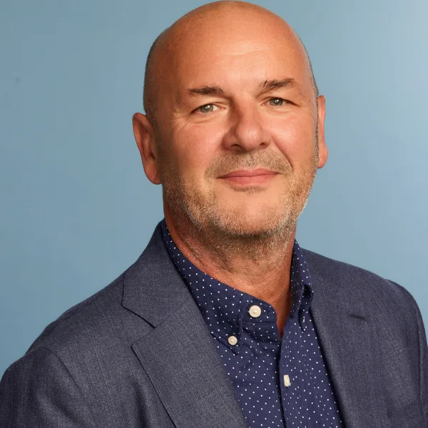 A man in a blue suit.