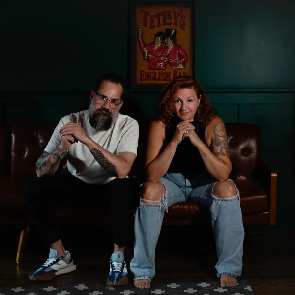 A man and a woman sitting on a couch