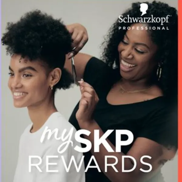 Two women, one is a hairstylist and the other woman is getting her hair cut.