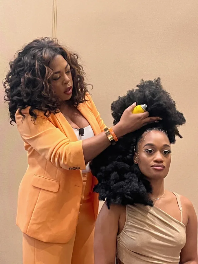 A hairstylist doing hair.