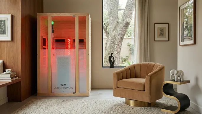 An image of a personal, walk-in sauna inside a living space.