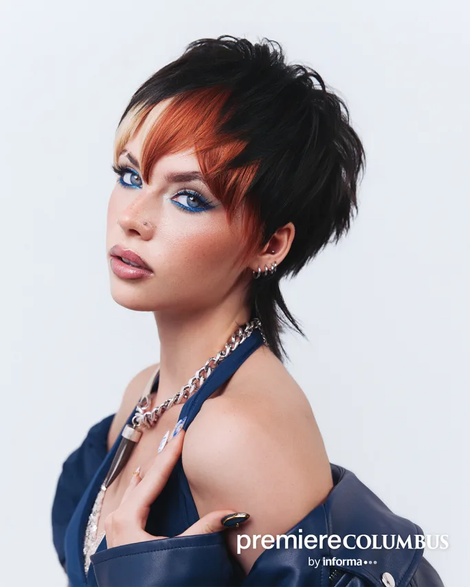 a woman with a red and black pixie cut
