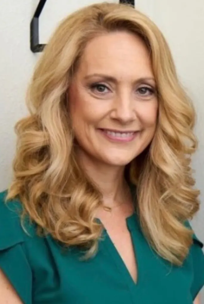 A smiling portrait of salon suite owner Amy Hazen