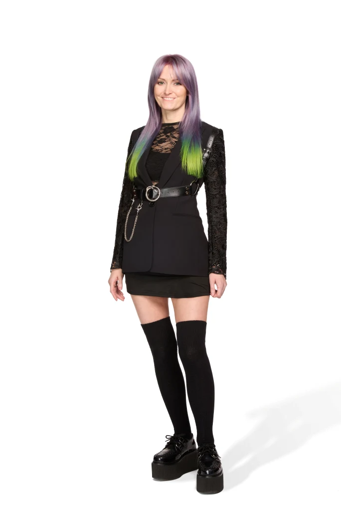 A woman in black with long green hair