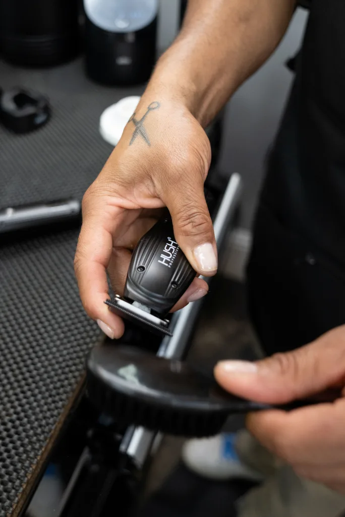 A hand holds a clippers