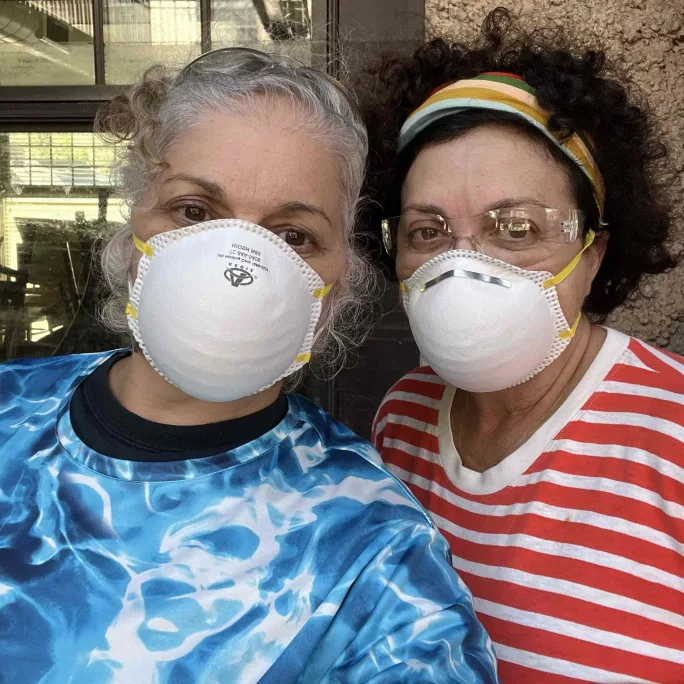 Christine DiBenedetto and Gilda Santiago masked up to do recovery work