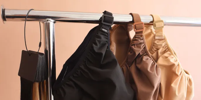 shower caps hanging on a pole