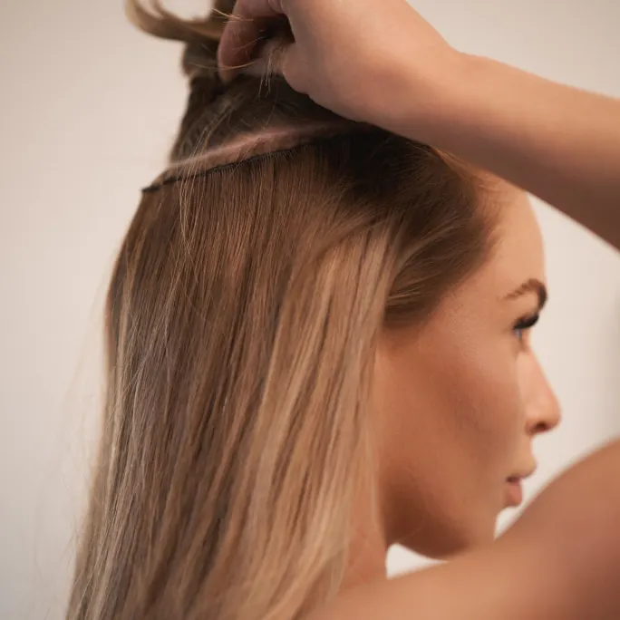 A woman holding up her hair