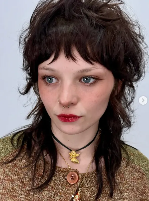 A young woman with a layered haircut