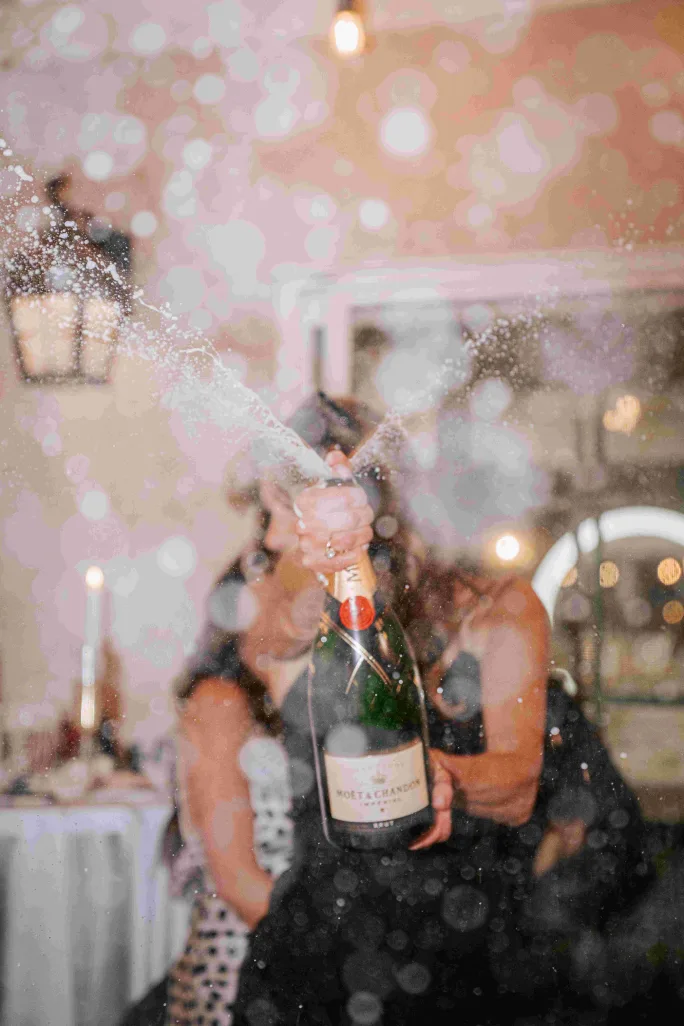 Founder Angela Pantaleone and champagne