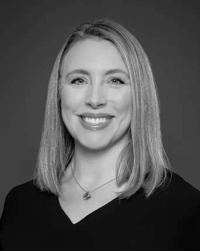 A smiling woman with blonde hair