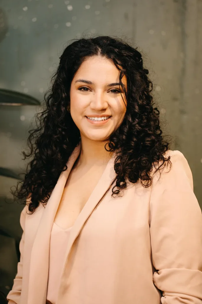 A smiling headshot of Carolina Cordoba