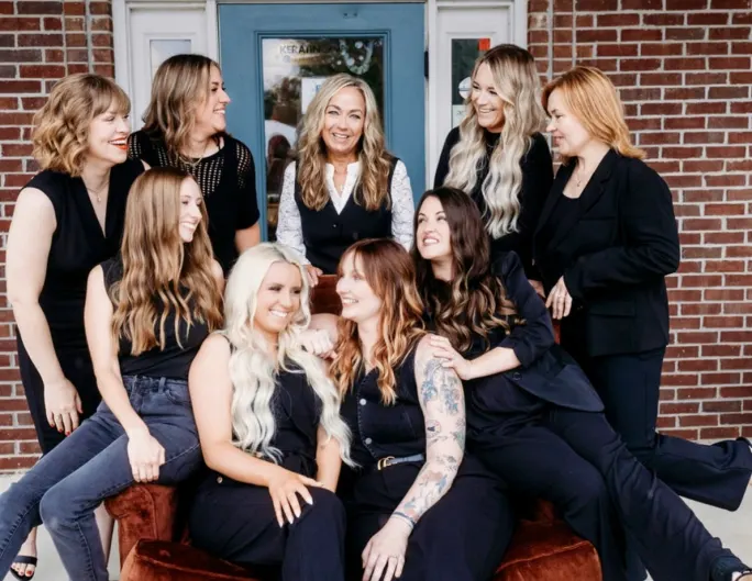 Stylists surround Owner Angi Snodgrass at Cass and Company Salon.