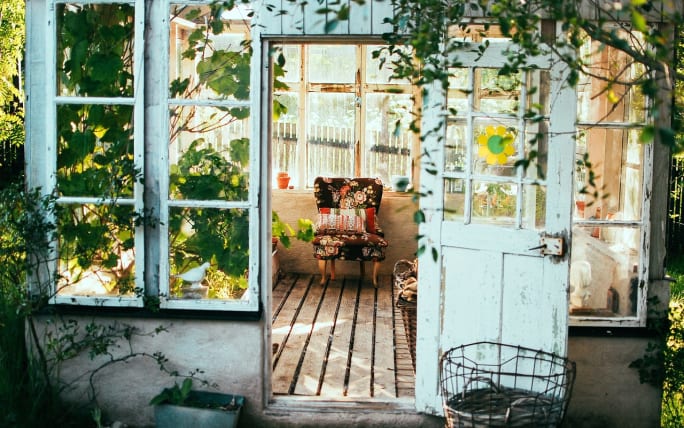 A chair in a small shack.
