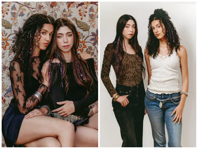 Two models with long hair and sparkly tinsel.