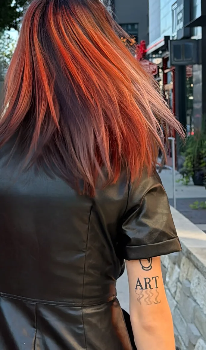 Model with completed Fairy Cut styled smooth, showing the final cut shape and Calico haircolor.