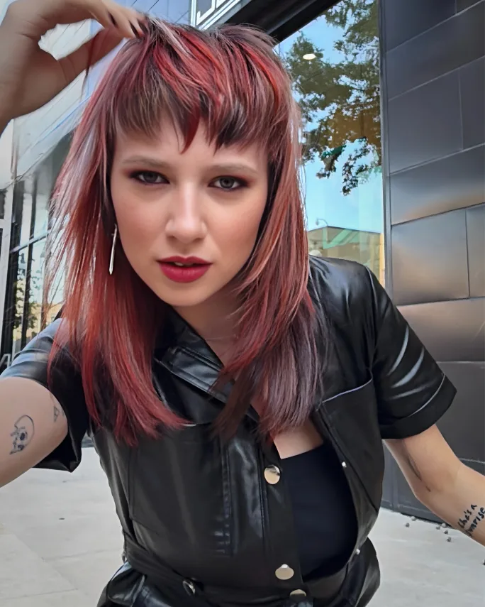 Model with completed Fairy Cut styled smooth, showing the final cut shape and Calico haircolor.