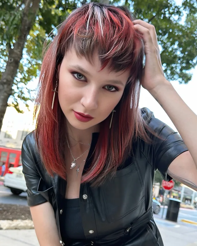 Model with completed Fairy Cut styled smooth, showing the final cut shape and Calico haircolor.