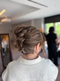High and textured French twist bun.