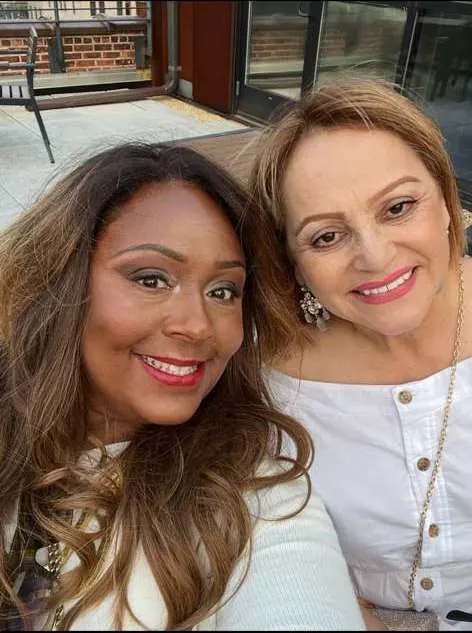Michaella Blissett-Williams huddles with her general manager Gloria Hortua