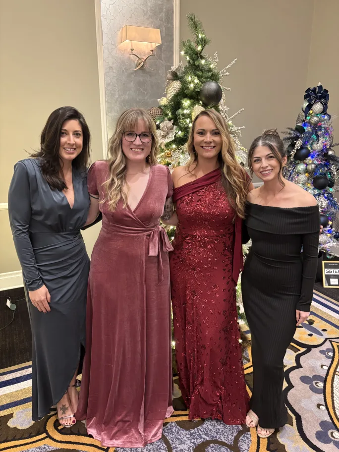 Team members from Revive Salon and Day Spa in formal attire.