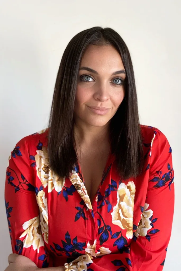 A woman in a red blouse.