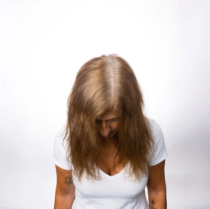 A woman with frizzy hair.