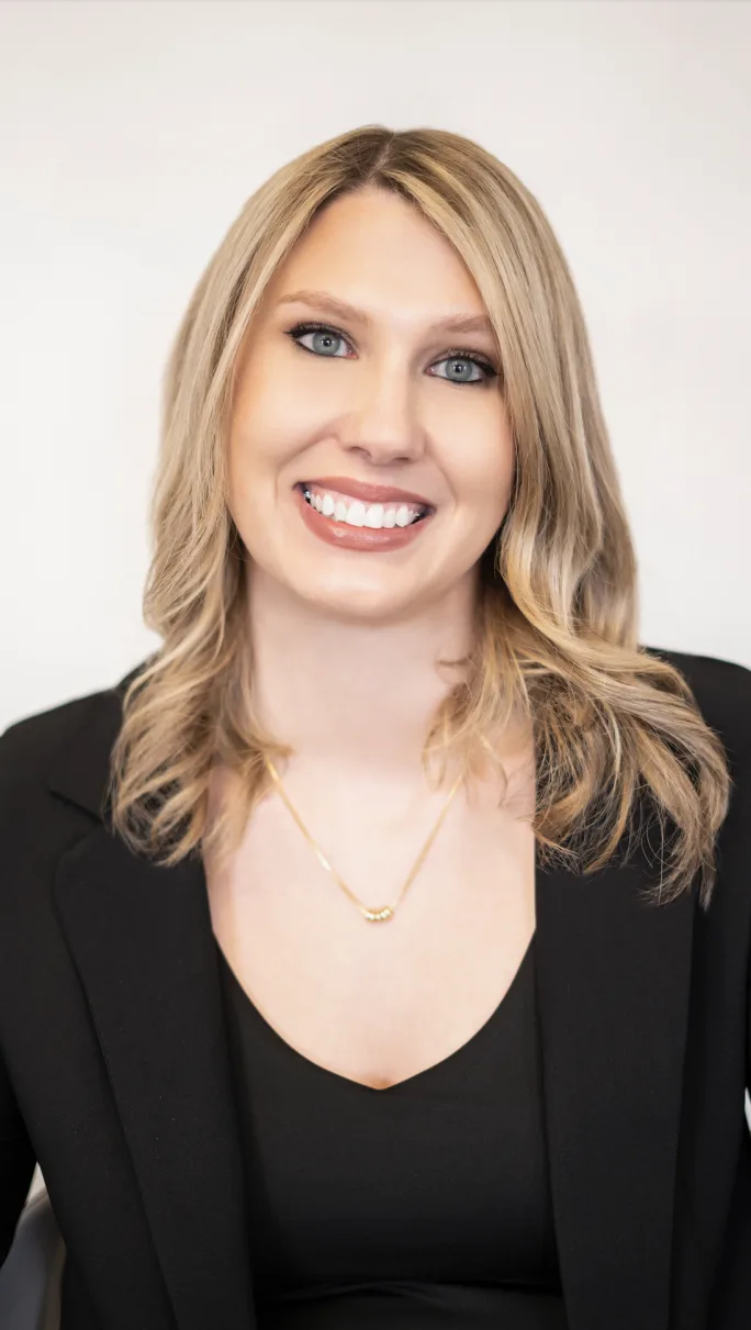 A smiling headshot of Liz Zavora, sales manager at Refined Beauty