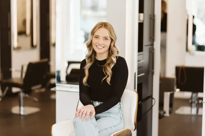 Salon Manaer Mallory Eithun sits at a station in Be Inspired Salon in Madison, Wisconsin