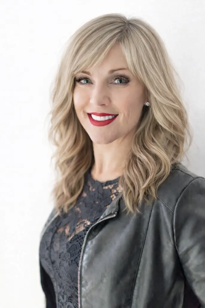 Natasha MacDonald, the Rusk Global Education Director, smiling, wearing black.