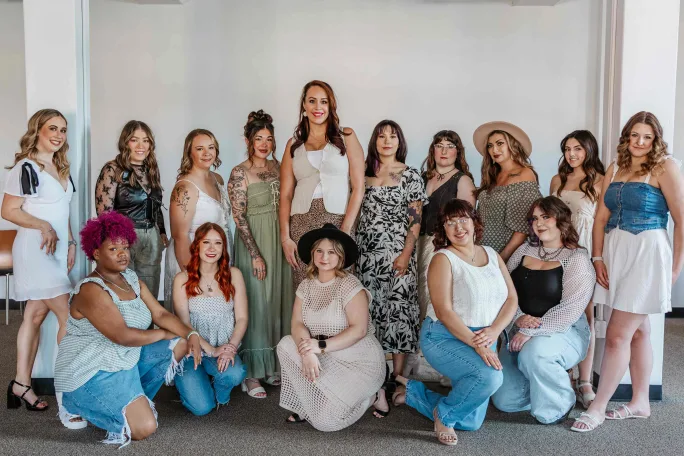 The team from Posh Salon and Boutique dressed in denim and light colors.