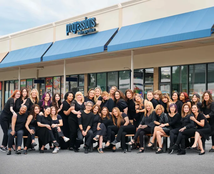 The team of Progressions Salon Spa Store outside the salon in Rockville, Maryland.