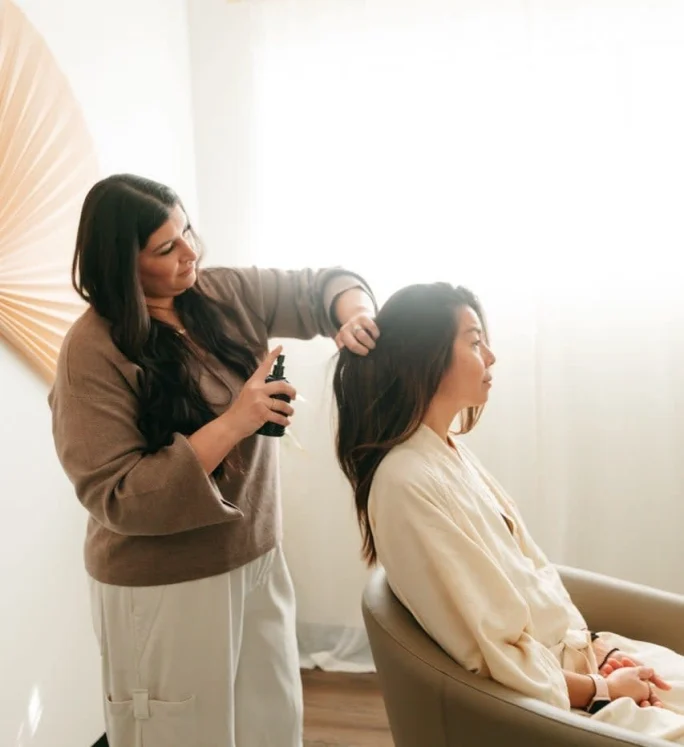 A stylist and client at Rind Head Spa. 