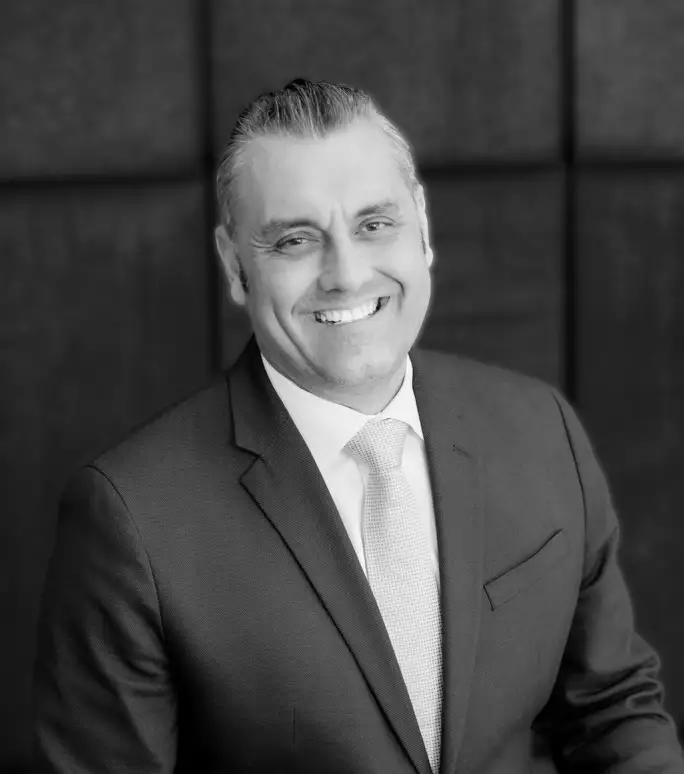 A smiling man in a suit