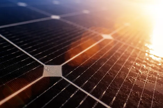 Close up images of solar panels with sunlight beaming down on them.