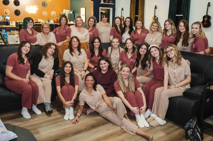 Dressed in matching pajamas, the team from Southwest Hair & Day Spa