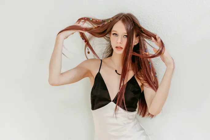 A young woman with long hair.