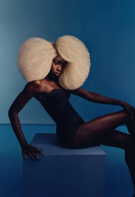 A model with a huge blonde afro on the set of Modern Salon and Ulta Beauty shoot.
