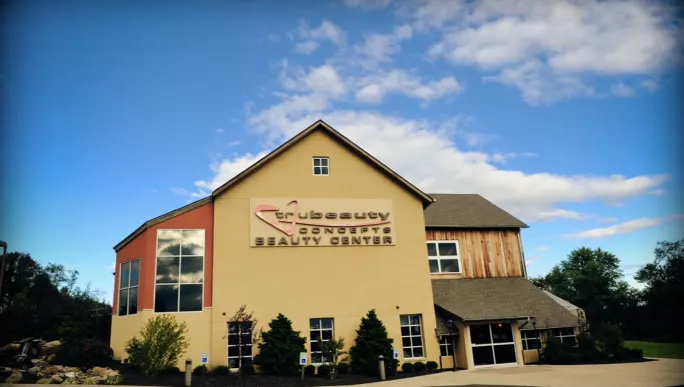 A beautiful education center surrounded by blue sky.