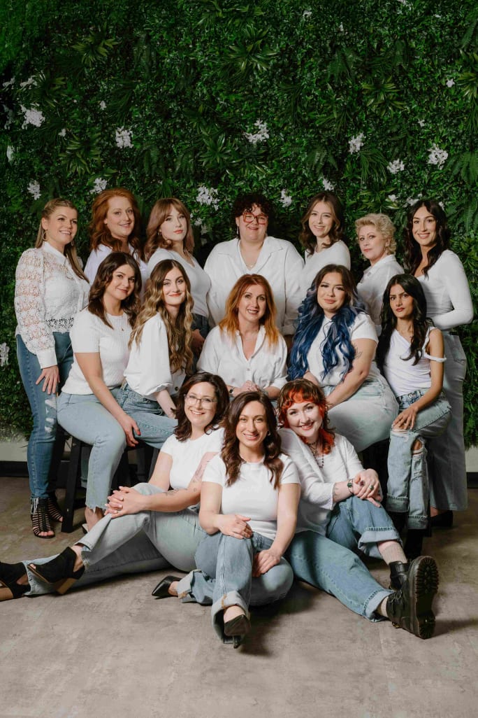 Posing in white shirts and jeans, the team from  Utopia Salon