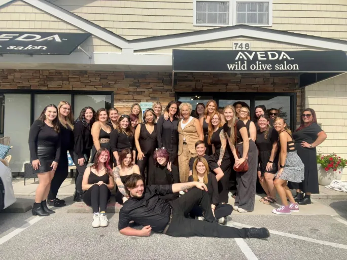 A group shot of the team from Wild Olive outside the salon.