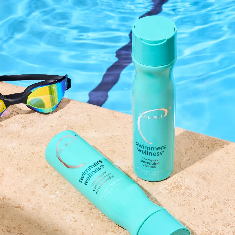 A hair care product package by a swimming pool
