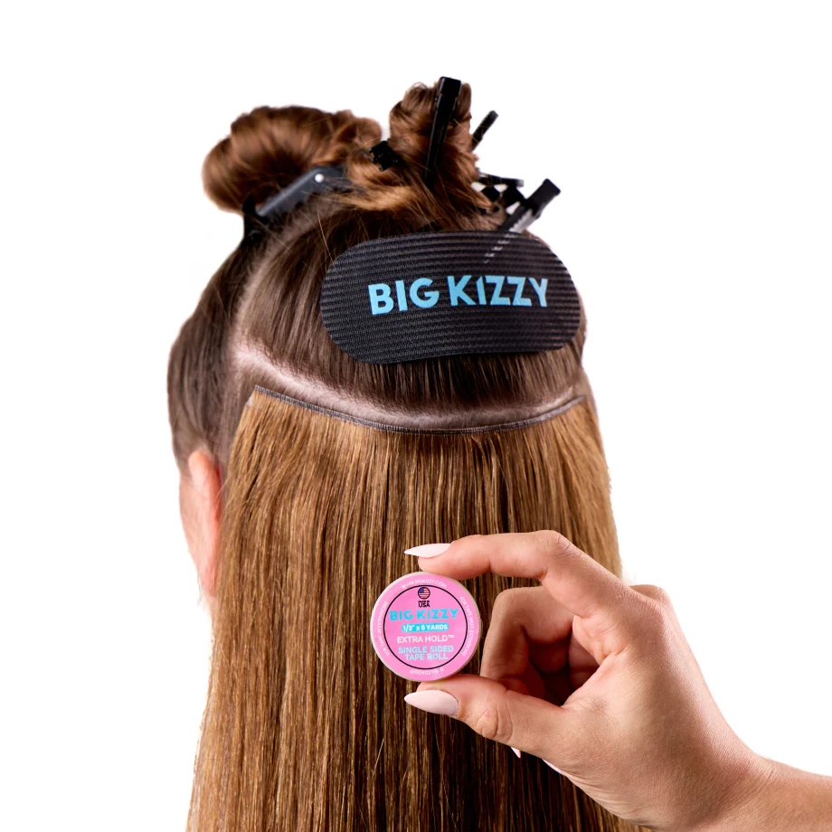 Model demonstrating the one sided tape roll in hair
